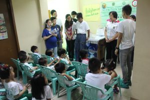 Kagawad Dr. Rose Milaor giving the opening remarks for the TFCA feeding program.